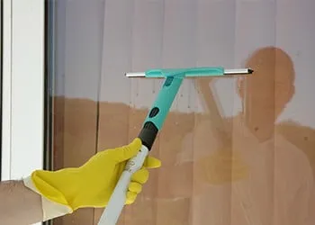 Squeegee cleaning a window